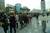 People are waiting to pay a tribute at a memorial for the victims.